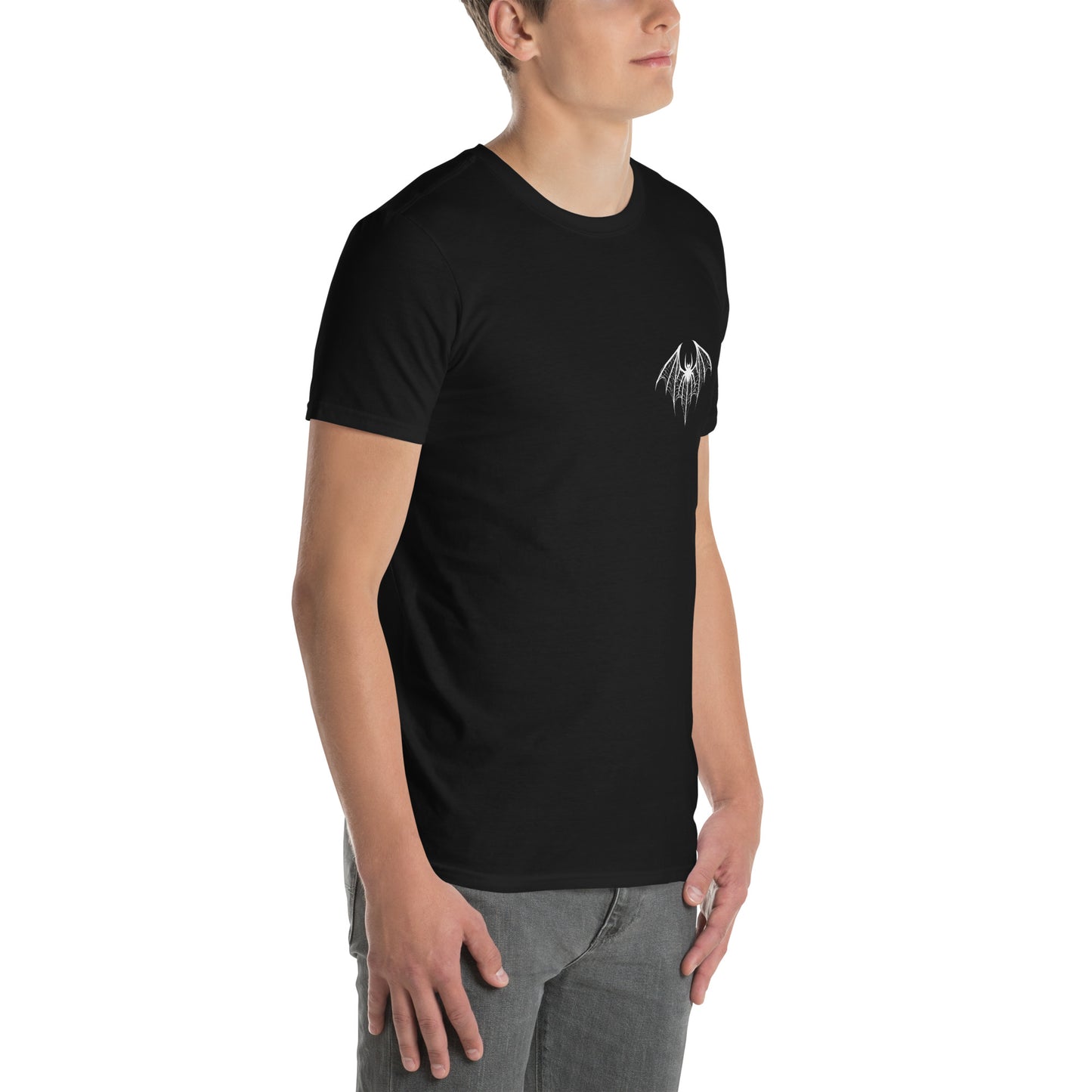 young white man wearing a black t-shirt with a white design of a spider-bat hybrid on the left chest. Perfect for those who love dark and unique aesthetics. Spiderbat Short-Sleeve Unisex T-Shirt - DarkSongWear