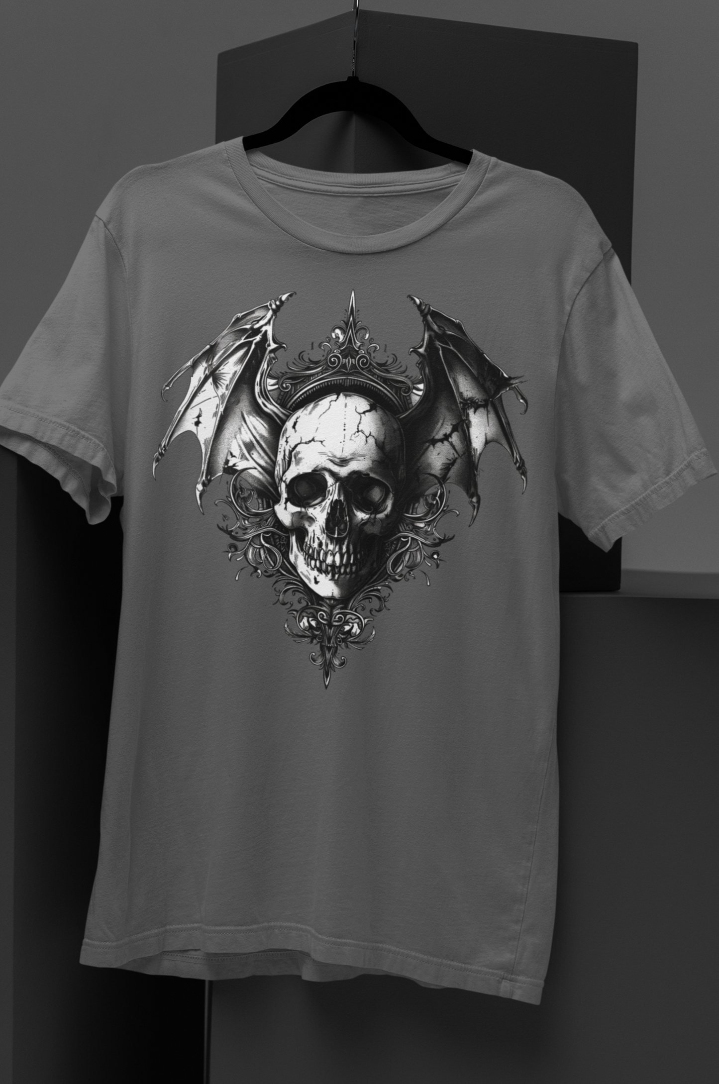 Gothic bat-winged skull with intricate dark ornaments, perfect for gothic fashion, occult aesthetics, and alternative streetwear. Gothic Bat Winged Skull Short-Sleeve Unisex T-Shirt - DarkSongWear