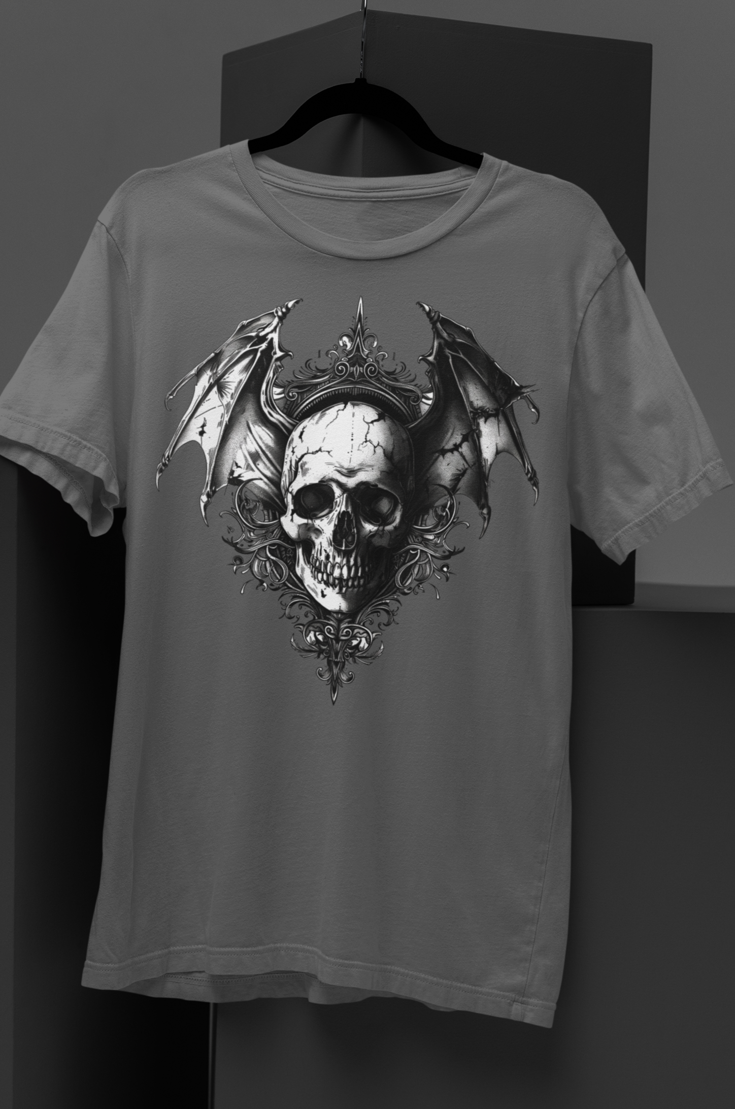 Gothic bat-winged skull with intricate dark ornaments, perfect for gothic fashion, occult aesthetics, and alternative streetwear. Gothic Bat Winged Skull Short-Sleeve Unisex T-Shirt - DarkSongWear