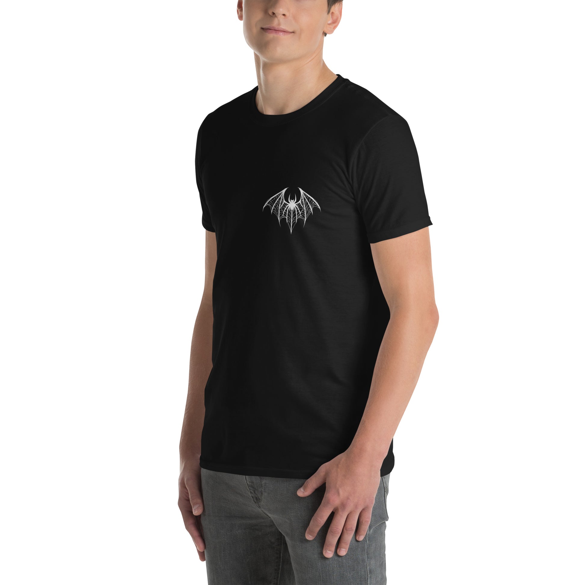  young white man wearing a black t-shirt with a white design of a spider-bat hybrid on the left chest. Perfect for those who love dark and unique aesthetics. Spiderbat Short-Sleeve Unisex T-Shirt - DarkSongWear